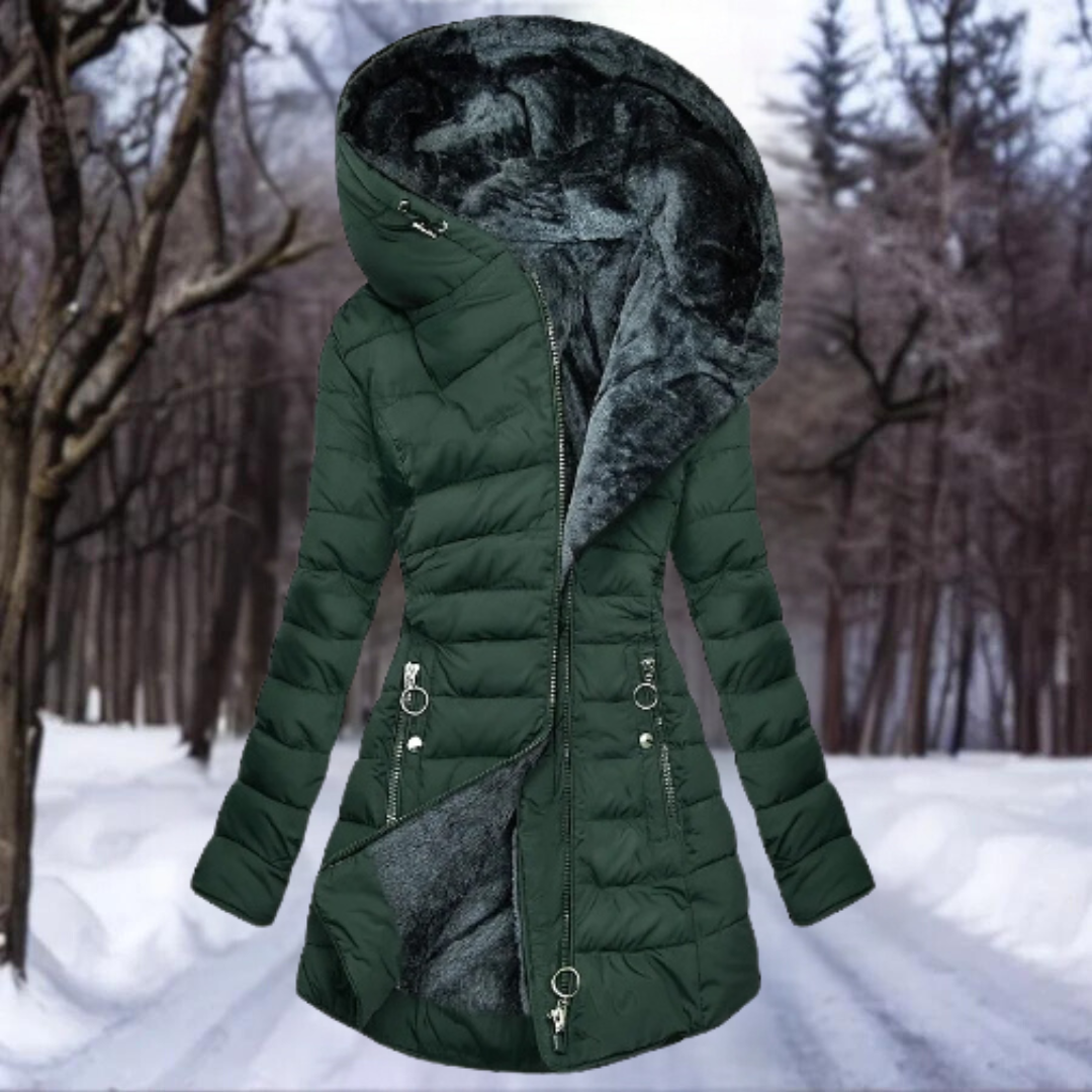 Green winter coat with fur-lined hood in a snowy forest setting